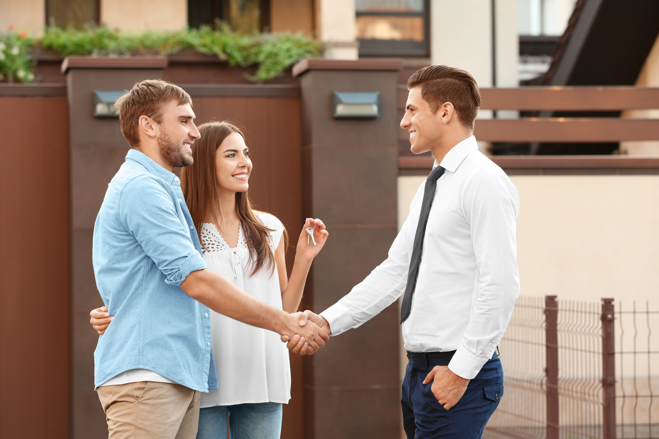 young couple meeting realtor